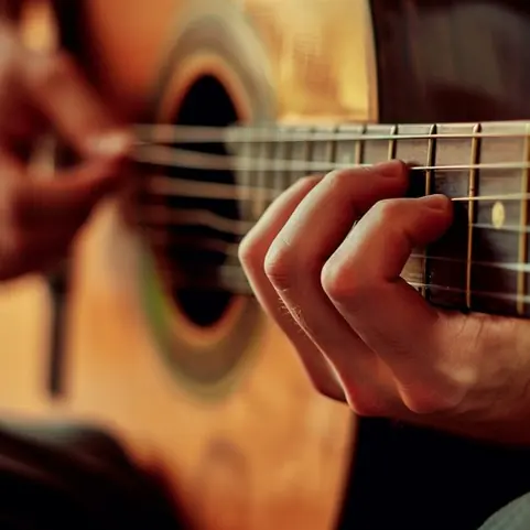 Playing acoustic guitar
